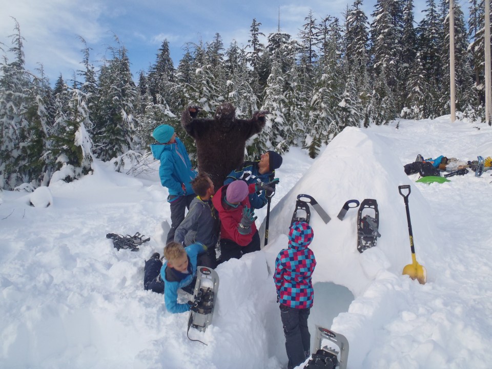 A Sasquatch surprises igloo builders!